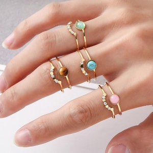 Set of four bohemian gold titanium steel rings with natural stones and zirconia accents