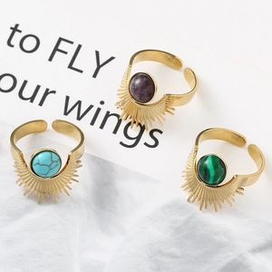 Golden sunburst open ring set featuring turquoise, purple, and malachite stones