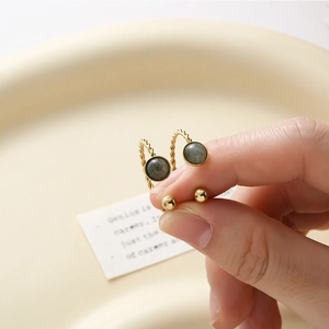 Retro 18K gold twist rope earrings featuring natural green stone inlays and bead accents