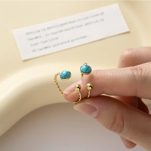 Minimalist stainless steel twisted ring set with natural turquoise and vintage gold finish