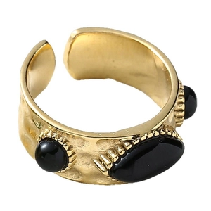 Vintage textured gold wide band ring with black stones and retro bohemian design