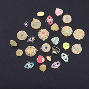 Colorful evil eye and heart charms in gold stainless steel with enamel and rhinestones