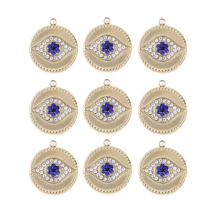 Set of nine golden evil eye charms with colorful rhinestones for DIY jewelry making