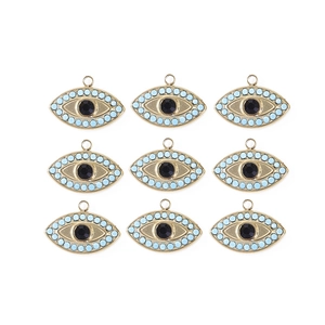 Macro shot of 9 blue crystal evil eye charms with golden edges for DIY jewelry making