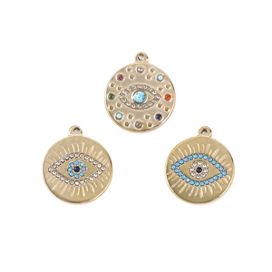 Detailed view of matte gold Evil Eye charms with colorful stones for DIY jewelry making
