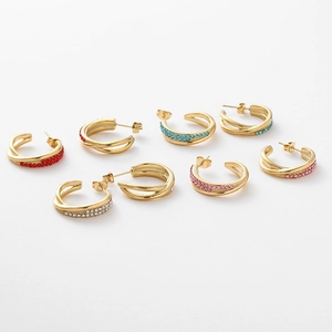 Macro detail of multicolored rhinestone C-shape earrings in various finish colors