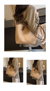 Detail of lychee pattern leather tote bag with brown trim in a lifestyle setting