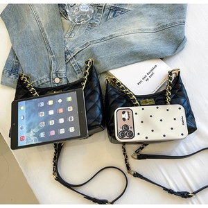 Detail view comparing two black quilted chain bags sizes with a tablet and smartphone
