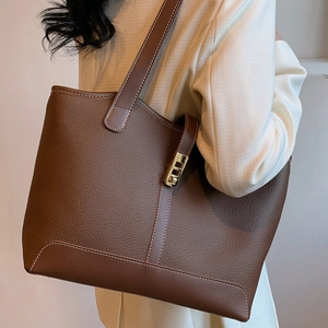 Large capacity dark brown leather tote bag with white stitching and gold hardware