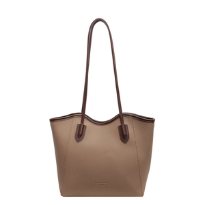 Minimalist beige lychee grain leather tote bag with brown straps and fashion trend logo