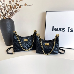 Black quilted hobo bags set with gold chain strap and turn-lock closure in two sizes