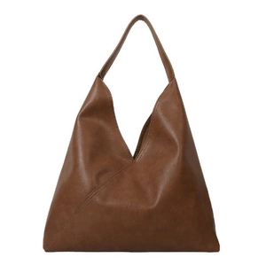 Brown vintage faux leather tote bag with wide shoulder strap and minimalist design
