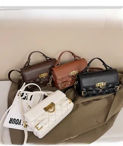 Group shot of four vintage quilted leather bags in brown, tan, black, and white colors