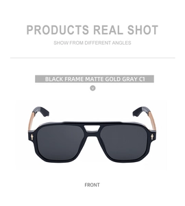 Front view of square black sunglasses with gray lenses and matte gold double-bridge frame