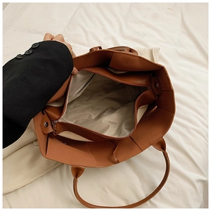 Deep brown tote bag interior with magnetic closure and inner zipper compartment