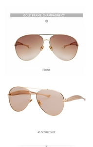 Detail view of gold metal aviator sunglasses with champagne gradient lenses