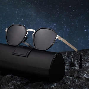 Polarized square sunglasses with screwless metal hinges on a textured stone base