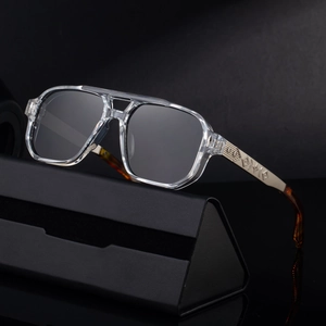 Fashion square sunglasses with transparent frames and gold floral engraved metal temples