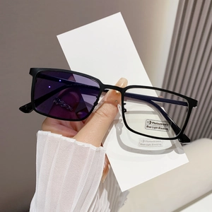 Detail view of photochromic lenses showing transition from clear to purple tint