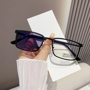 Square photochromic blue light blocking glasses with black frame for men in outdoor use