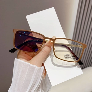 Detail of photochromic rectangular frames showing purple tinted lens and temple specs