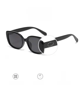 Detail of square polarized sunglasses featuring silver oval metal temple decoration