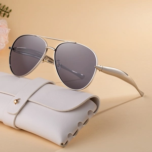 Classic aviator sunglasses with gold metal frame and white leather case for women