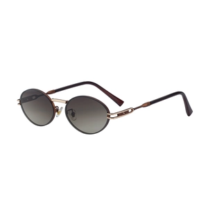 Retro oval sunglasses with gradient brown lenses and golden metal bridge on white background