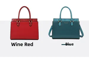 Detail showing wine red and blue tote bags with crocodile pattern leather and metal hardware