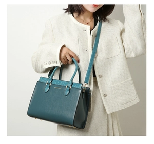 Detail of dark blue tote bag with lychee grain and crocodile pattern stitching
