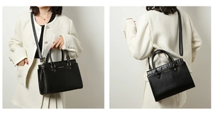 Detail of black tote bag with croc-embossed trim and gold hardware in two styles