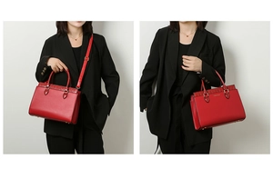 Red leather tote bag featuring crocodile pattern panels and elegant gold-tone hardware