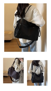 Detail of large nylon tote bag in black and dark coffee featuring adjustable shoulder straps