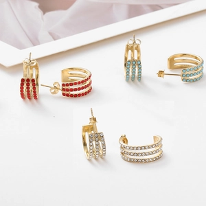 Three-row C-shaped gold earrings with turquoise, red and white crystals detail