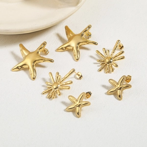 Golden starfish and sunburst earring set in polished and textured stainless steel