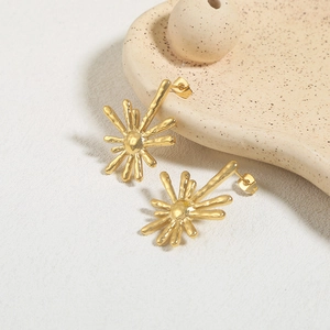 Golden sunburst style starfish earrings with irregular lava texture for women