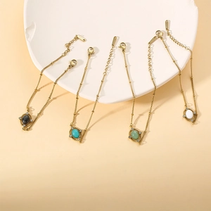 Japanese style titanium steel bracelet with natural oval stones in gold finish
