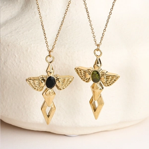 Gold Angel Sword necklace with black and green gemstones and detailed wing textures