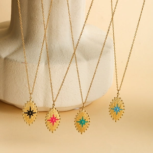 Detailed macro view of French style starburst pendants in four colorful enamel options