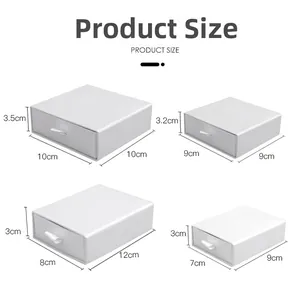 White minimalist drawer jewelry boxes in four sizes with ribbon handles for storage