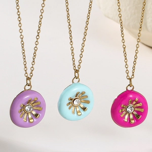 Detailed close-up of colorful enamel sunflower pendants with sparkling cubic zirconia centers