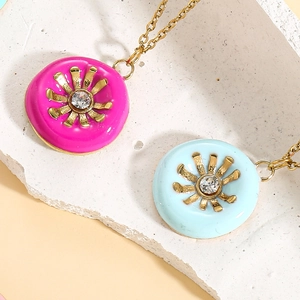 Macro view of colorful enamel sunflower necklaces with gold chain and zircon inlay