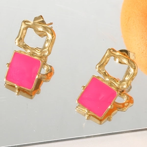 Retro geometric square drop earrings in gold metal with pink enamel on a mirror