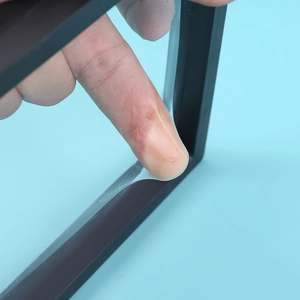 Close-up of highly elastic PE film on a black jewelry box showing strong durability