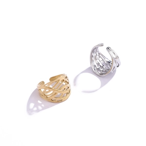 Detail of woven hollow wide band rings in polished gold and silver stainless steel