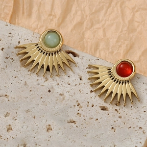 Detailed view of fan-shaped vintage earrings with green and red natural stone insets