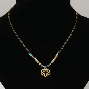 Detailed view of bohemian gold chain with faceted colored beads and shell pendant