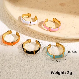 Detailed view of 5cm width enamel bamboo rings in multiple colors showing size measurements