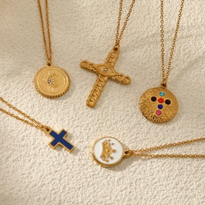 Golden multi-layered necklace set featuring cross pendants and colorful enamel charms