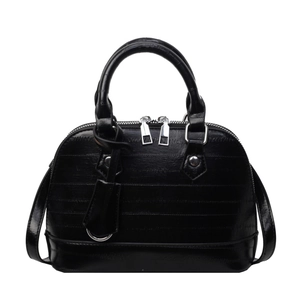 Classic black shell bag with glossy leather, parallel stitching and silver hardware